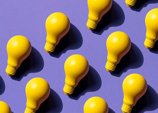 Yellow lightbulbs on a purple background